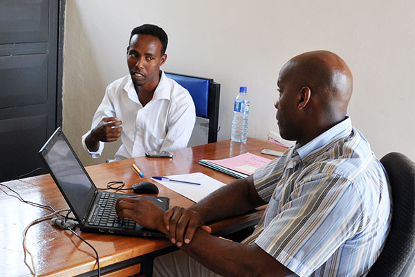 An ICMC resettlement expert conducts an interview with a refugee in Uganda