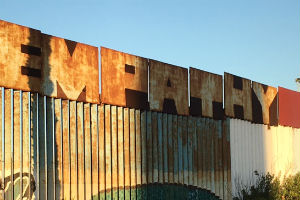 A painting on the Mexican side of the border, calling for more empathy for migrants.
