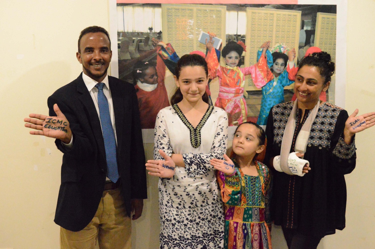 Two Afghan refugee girls meet with Samina and Hasan, a Somali interpreter, who is sponsoring their studies.