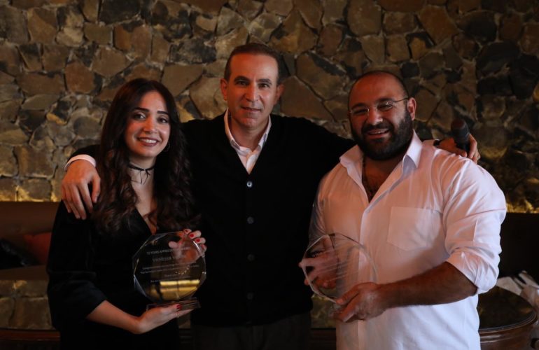 Former ICMC Head of Office in Lebanon Mehmet Sari (centre), with ICMC colleagues Vanessa Vania and Samer Abi Abdallah, at a 2023 Christmas celebration in Lebanon